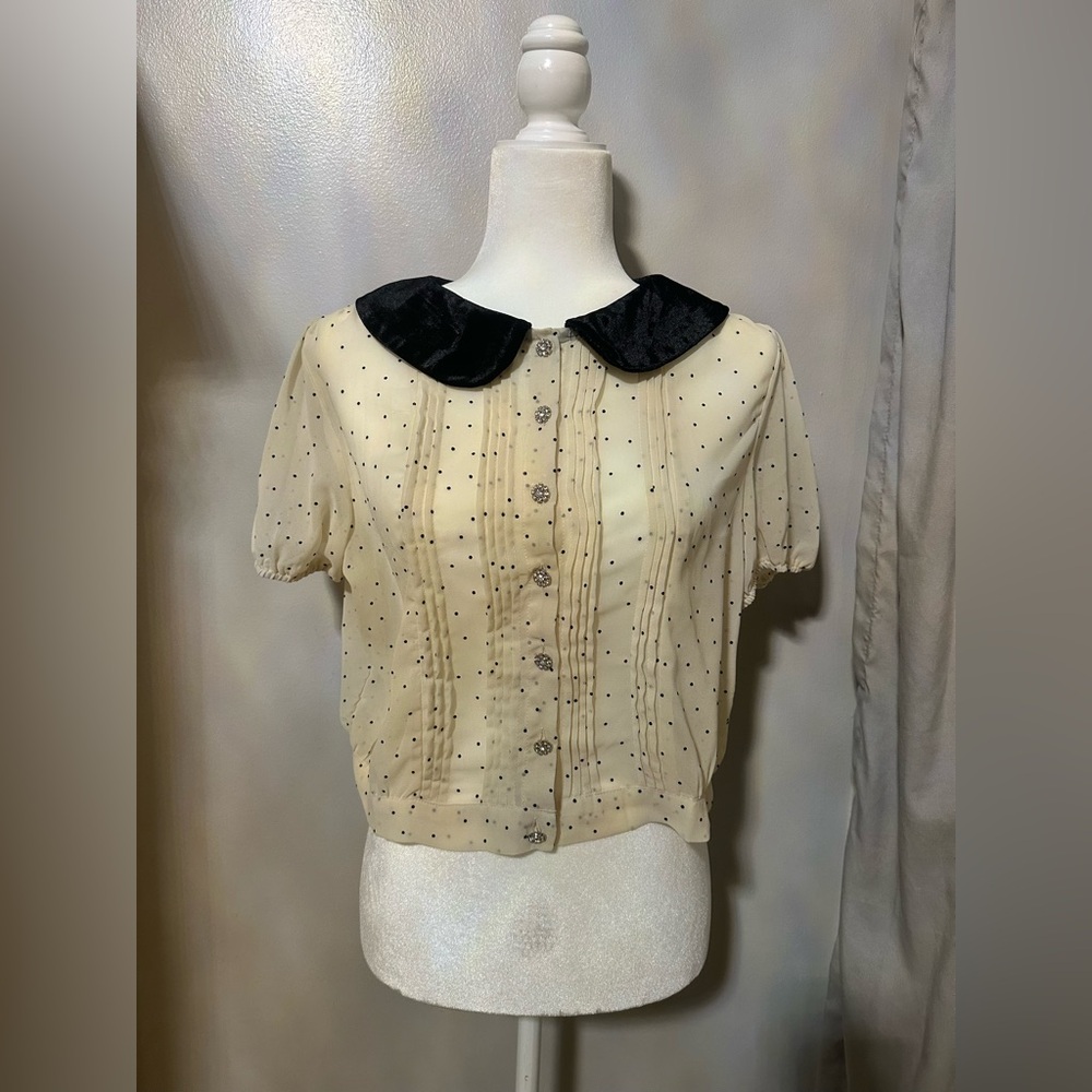 Cream polka dot crepe blouse with black velvet collar and rhinestone buttons